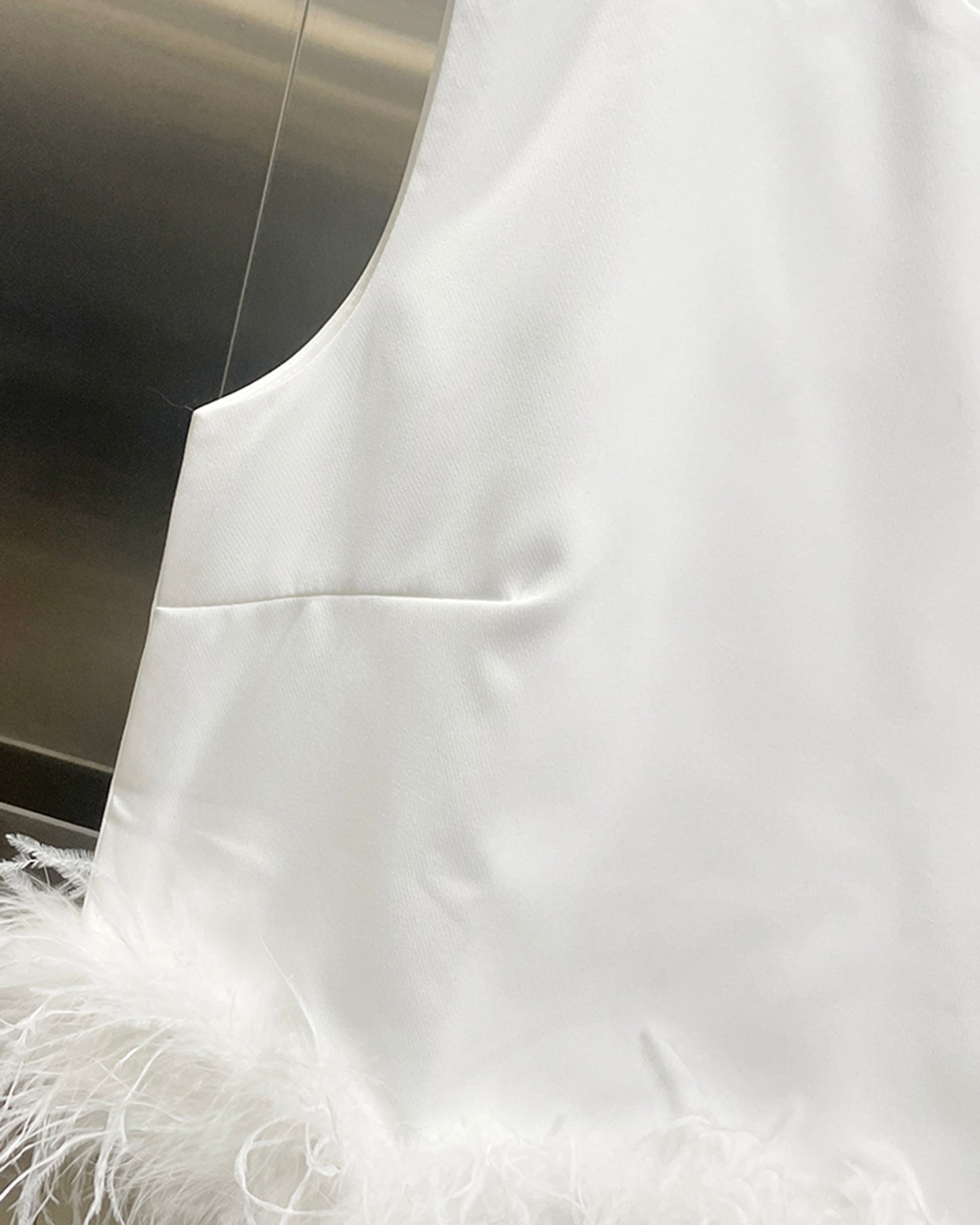 White Sleeveless Top with Feather Hem