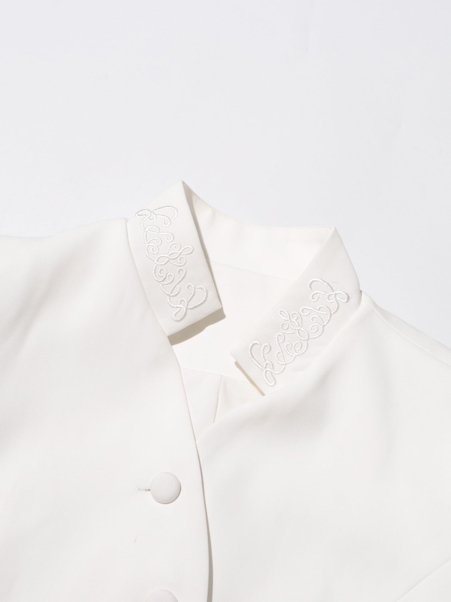 Elegant White Embroidered Jacket and Pleated Maxi Skirt Suit - SISPELL